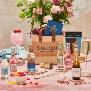 A table with gin, tonics and prosecco next to a jute bag